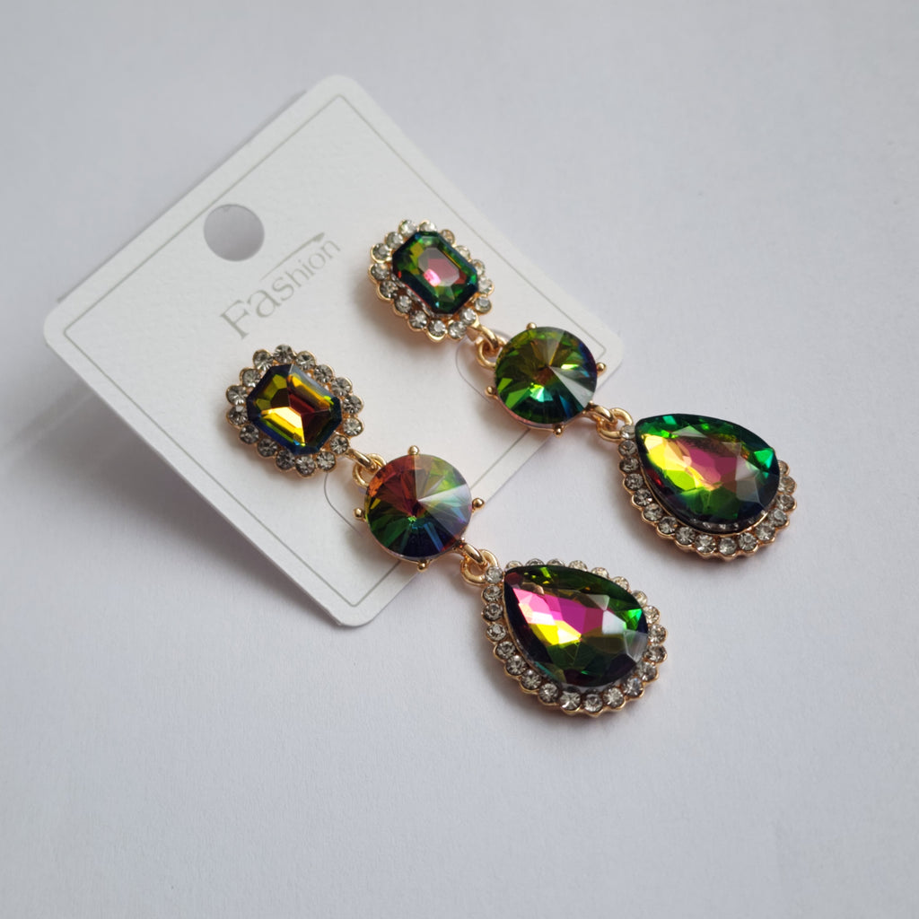 Multicolored gemstone earrings on a white card with a light gray background