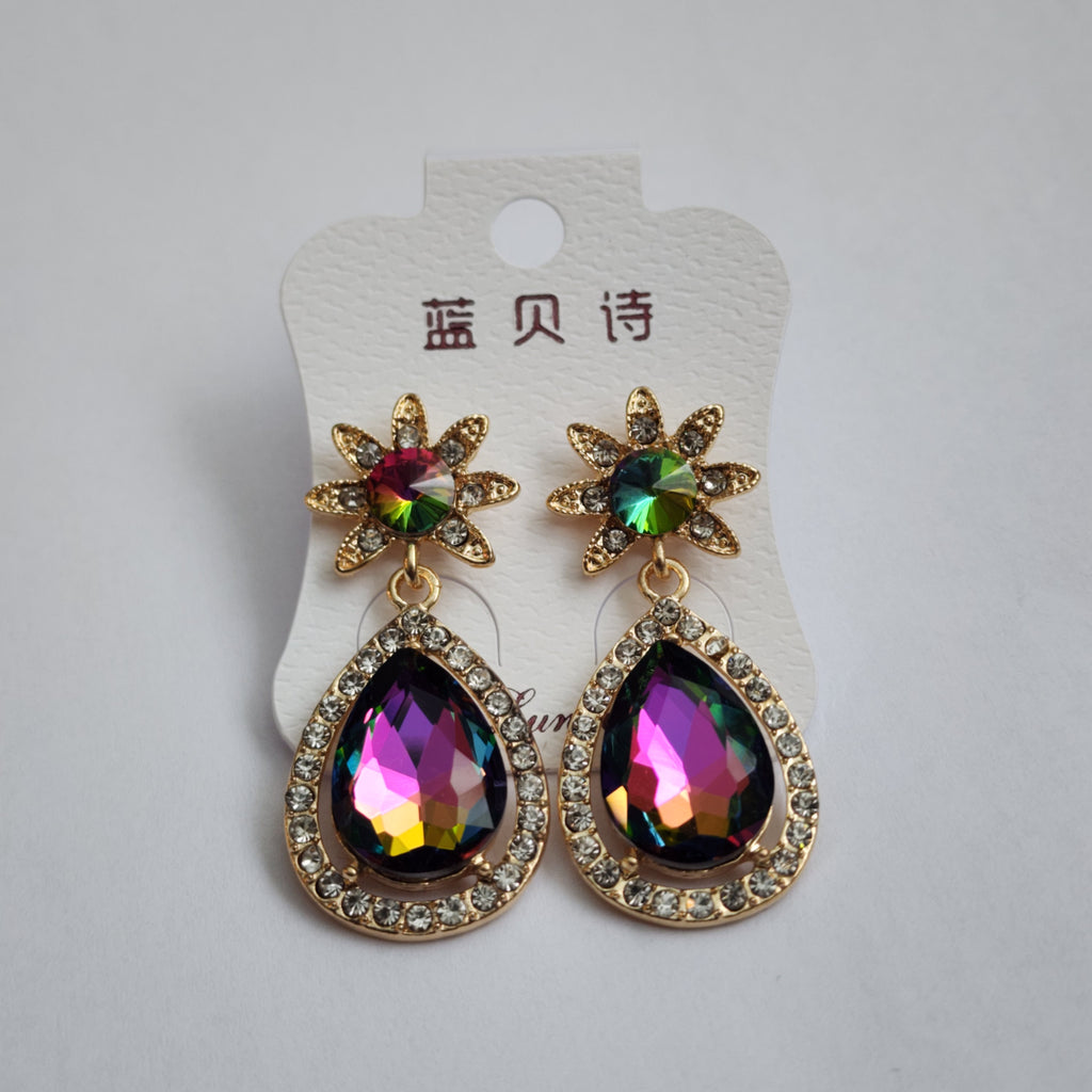 Pair of colorful earrings on a white card with text
