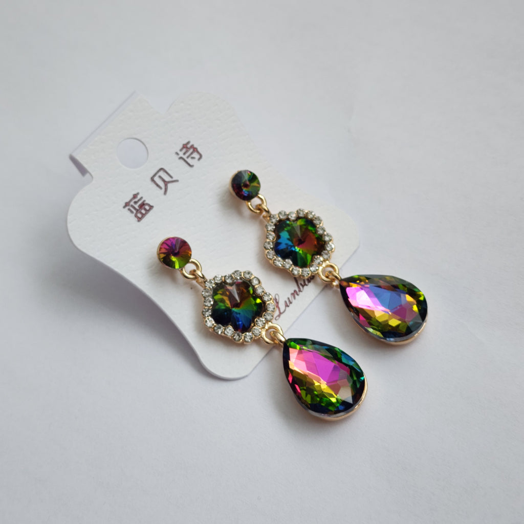 Multicolored teardrop earrings on a white card with text