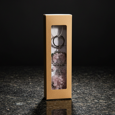 Gold jewelry box with a clear window on a dark surface