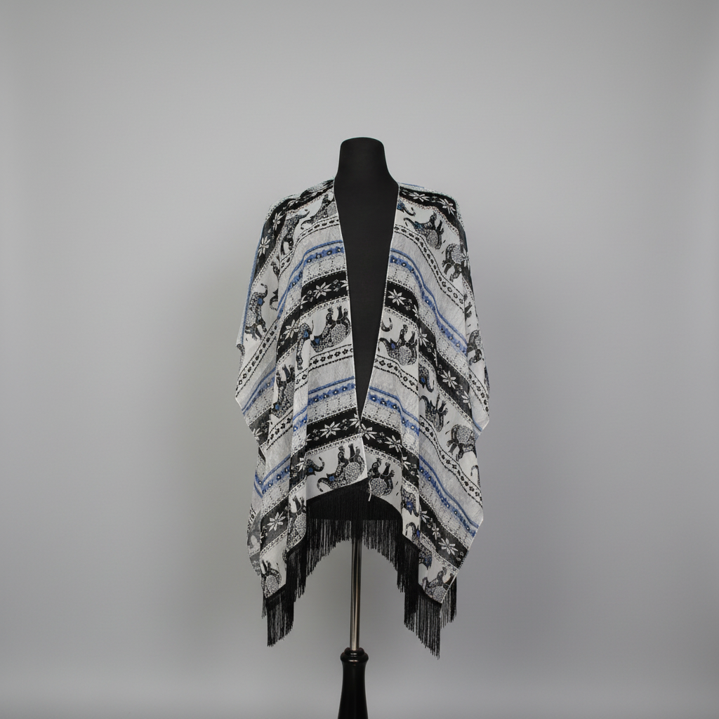Ivory elephant print fringe kimono cover-up with black fringe trim on mannequin.