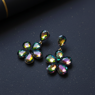 Multicolored gemstone earrings on a dark background